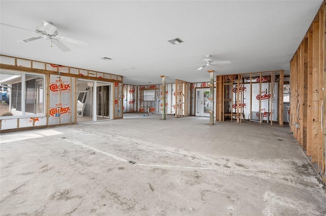 miscellaneous room featuring ceiling fan and concrete floors