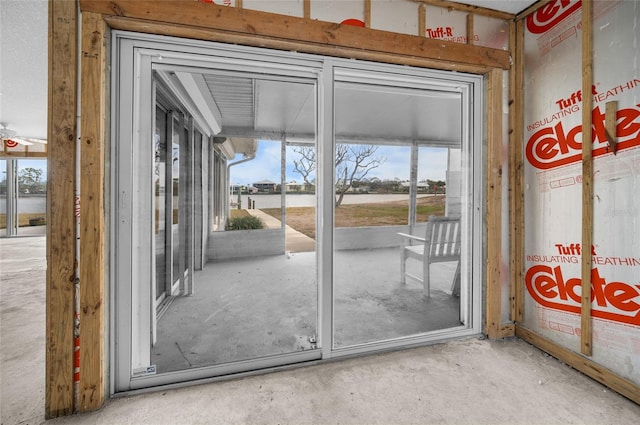 doorway featuring concrete flooring and a healthy amount of sunlight