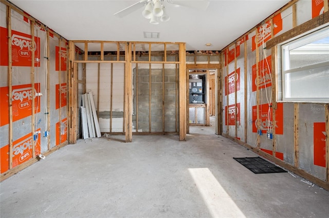 misc room featuring concrete floors and ceiling fan