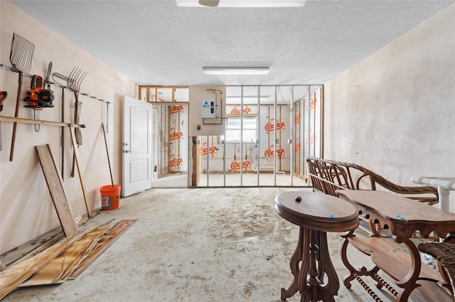 interior space with concrete flooring and a textured ceiling