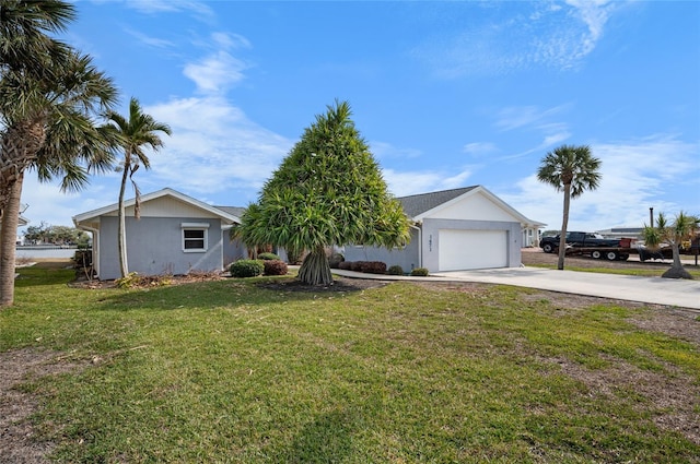 ranch-style house featuring a garage and a front yard