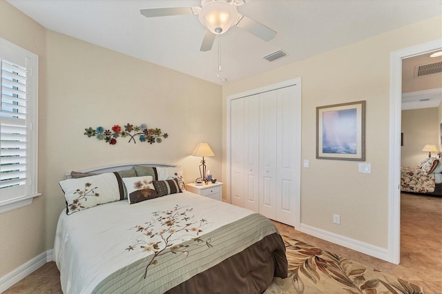 bedroom with multiple windows, a closet, and ceiling fan