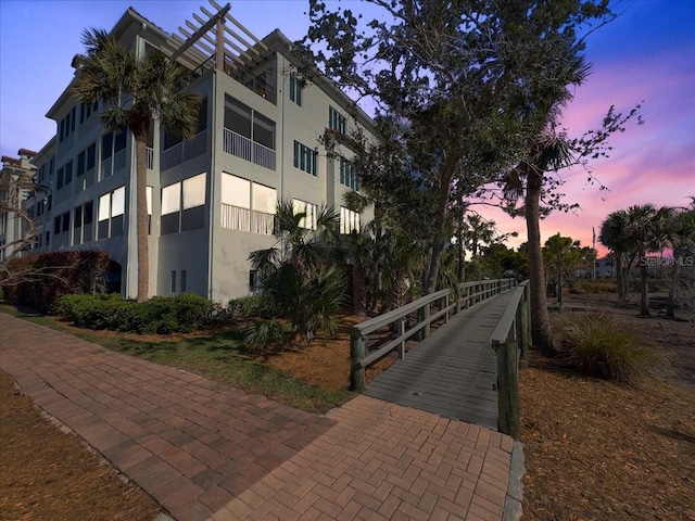 view of outdoor building at dusk