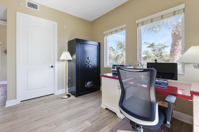 office with light wood-type flooring