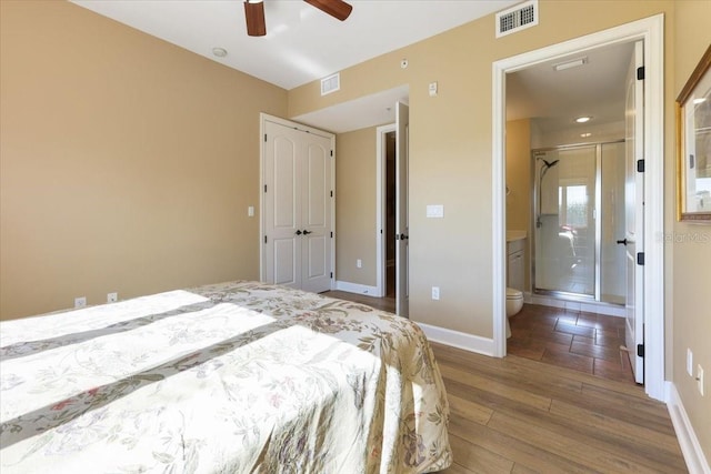 bedroom featuring ceiling fan, ensuite bathroom, and hardwood / wood-style floors