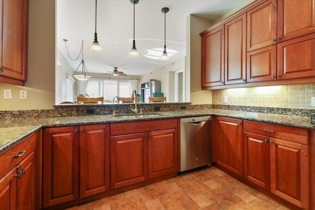 kitchen featuring tasteful backsplash, sink, dark stone countertops, hanging light fixtures, and stainless steel dishwasher