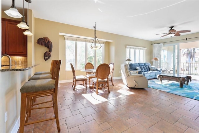 dining room with sink and ceiling fan