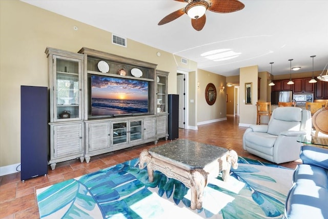 living room featuring ceiling fan