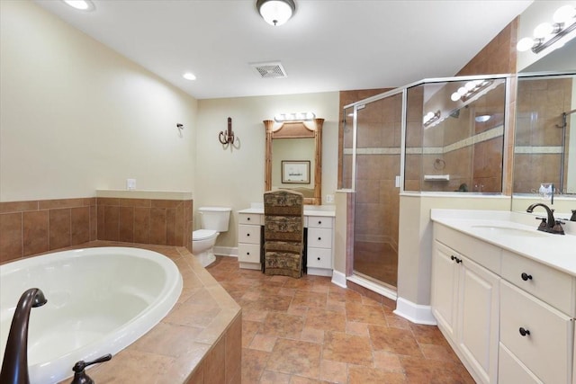 full bathroom with vanity, toilet, and separate shower and tub