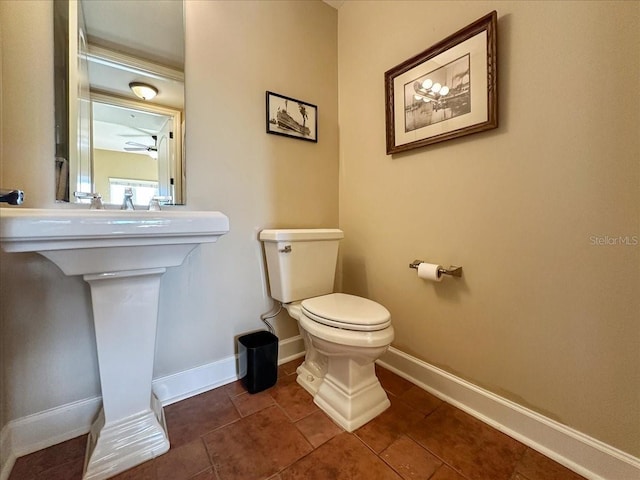 bathroom with tile patterned floors and toilet