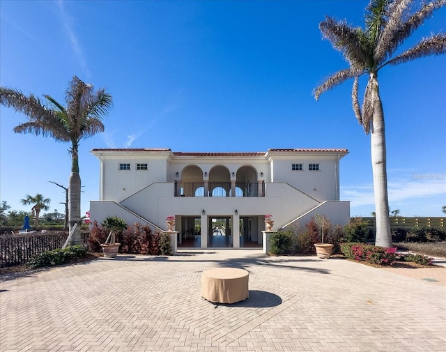 back of house with a balcony