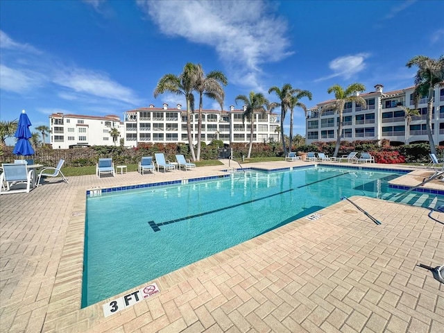 view of swimming pool featuring a patio area