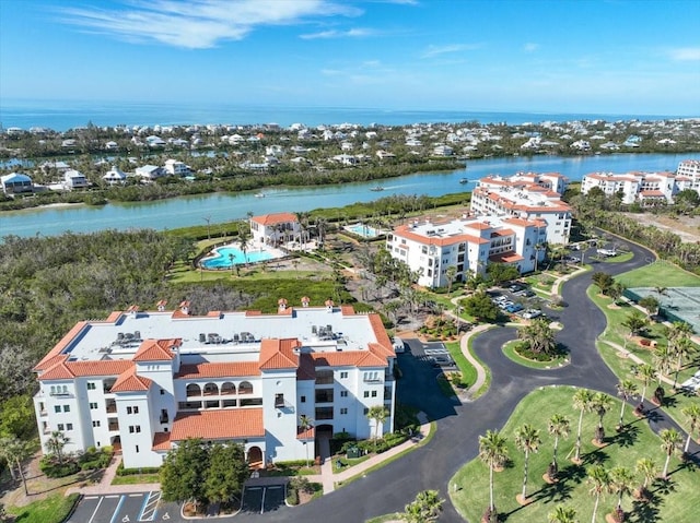 birds eye view of property featuring a water view