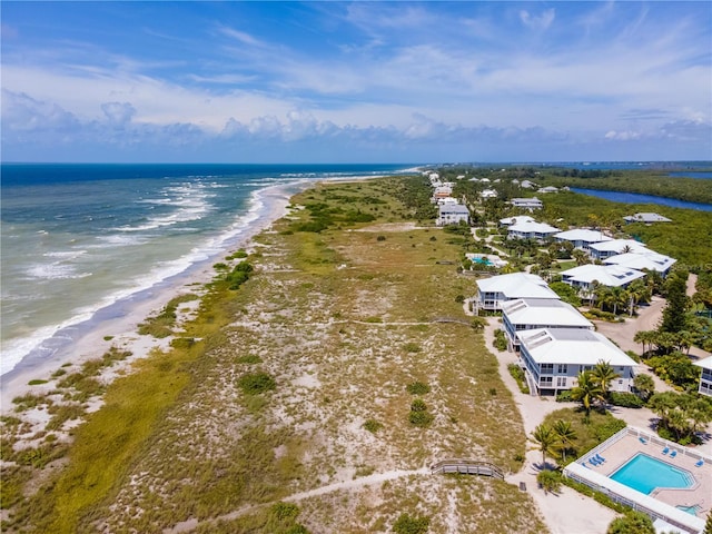 aerial view with a view of the beach and a water view