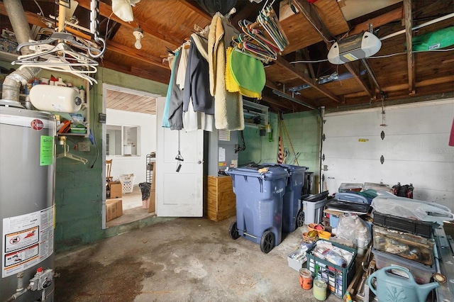 garage with gas water heater and a garage door opener