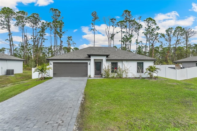 ranch-style home with central AC unit, a garage, and a front lawn