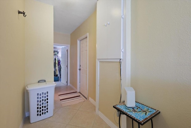 hallway featuring light tile patterned flooring