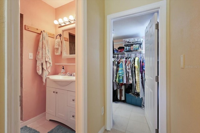 bathroom with tile patterned floors and vanity