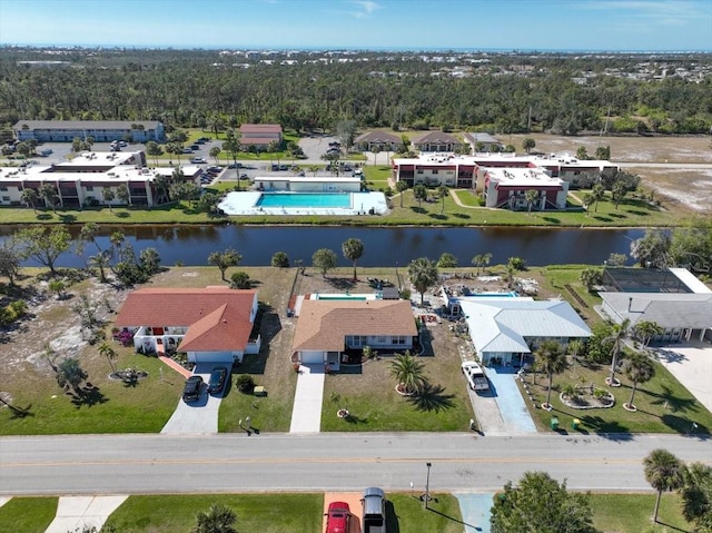 birds eye view of property featuring a water view