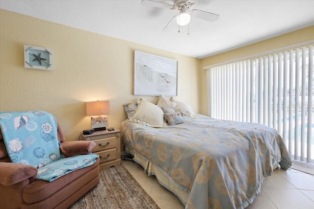 bedroom featuring ceiling fan and light tile patterned floors