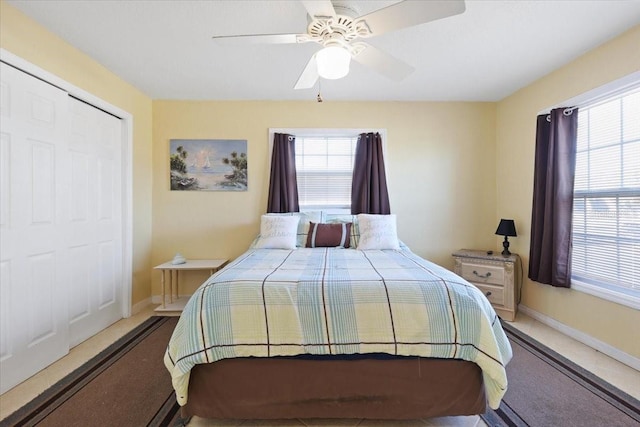 bedroom with a closet, ceiling fan, and carpet