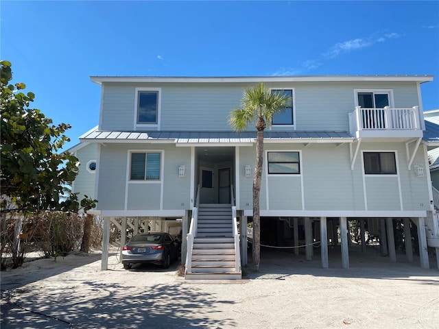 coastal home with a carport and a balcony