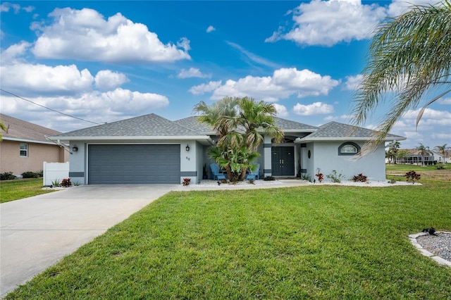 ranch-style home featuring a garage and a front yard