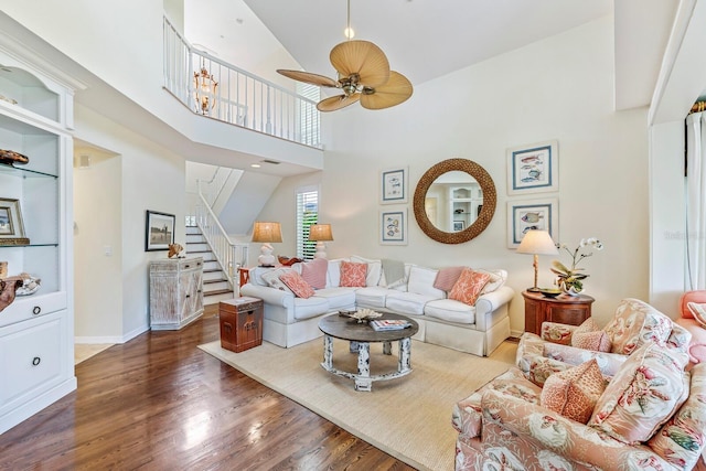 living room with high vaulted ceiling, ceiling fan, and dark hardwood / wood-style floors