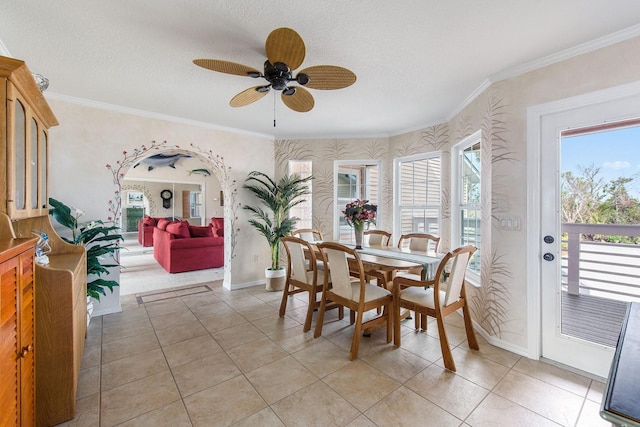 dining room featuring light tile patterned floors, crown molding, and a textured ceiling