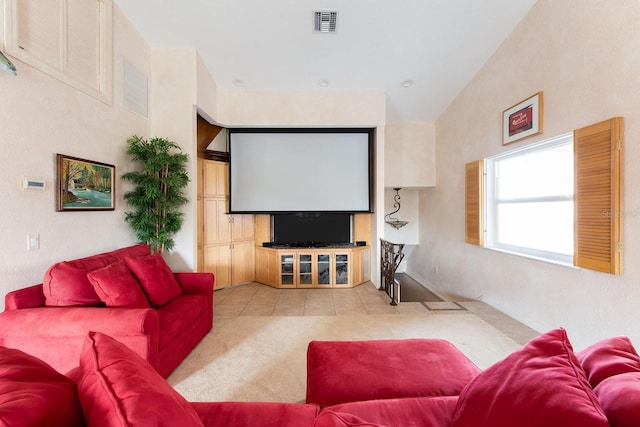 home theater room featuring light tile patterned flooring