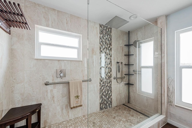 bathroom featuring a tile shower