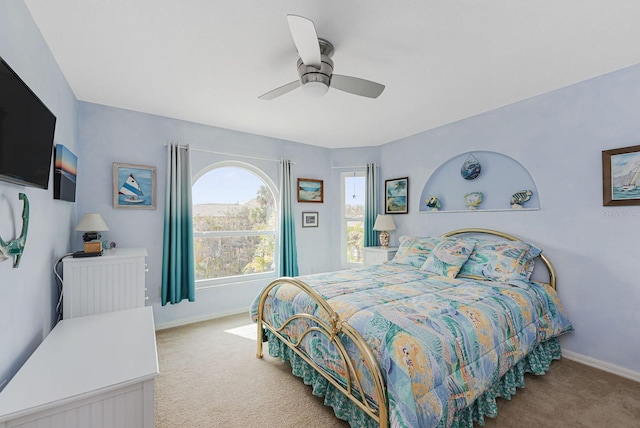 carpeted bedroom featuring ceiling fan