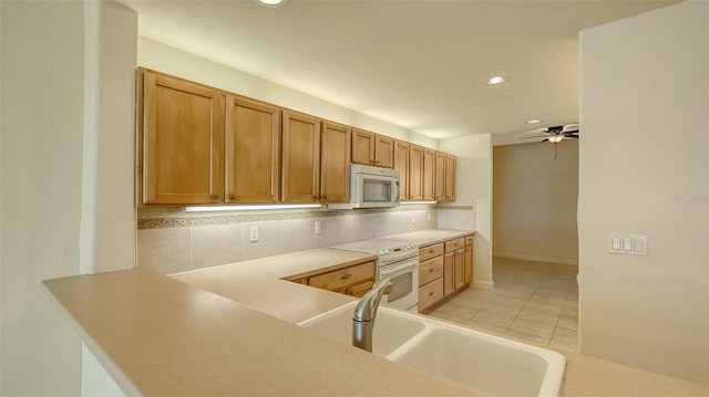 kitchen with light tile patterned flooring, sink, ceiling fan, white range with electric cooktop, and decorative backsplash