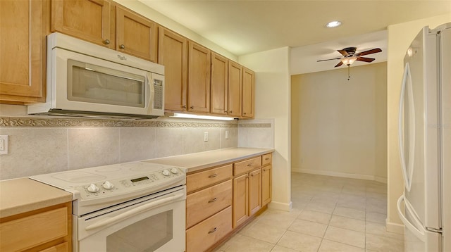 kitchen with tasteful backsplash, ceiling fan, light tile patterned floors, and white appliances