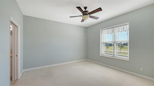 carpeted empty room with ceiling fan