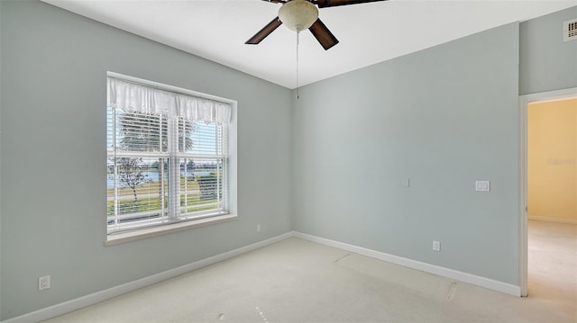 spare room with carpet flooring and ceiling fan