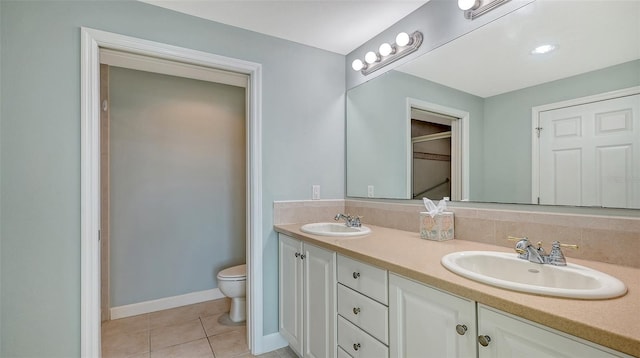 bathroom with vanity, tile patterned floors, and toilet