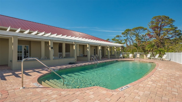 view of pool featuring french doors and a patio area