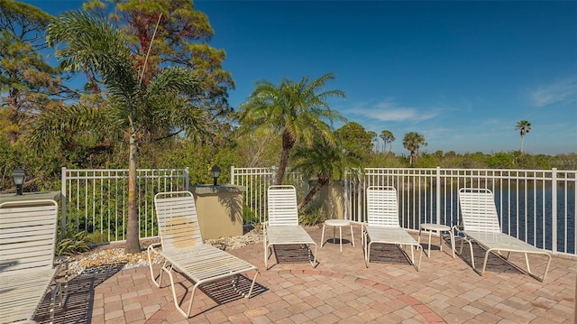 view of patio / terrace with a water view