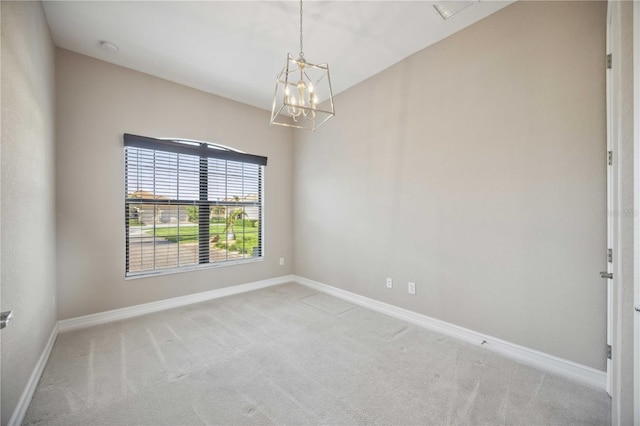 unfurnished room with carpet flooring and an inviting chandelier