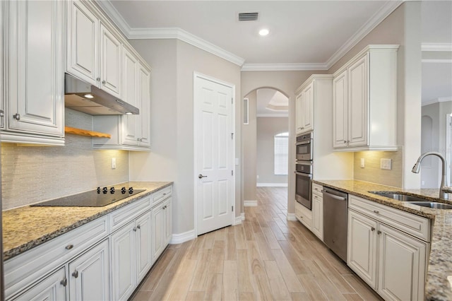 kitchen featuring sink, stainless steel dishwasher, white cabinets, and black electric cooktop