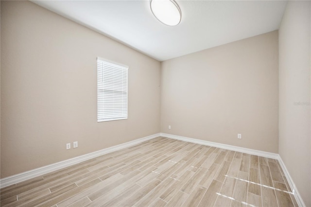 unfurnished room with light hardwood / wood-style flooring