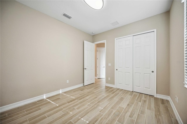 unfurnished bedroom featuring a closet