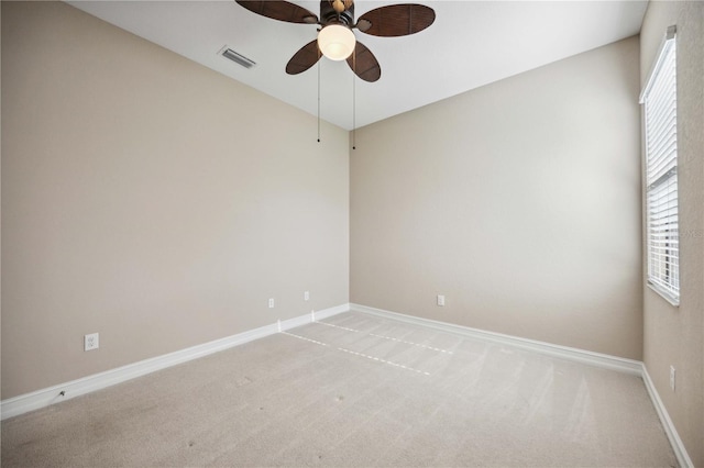 unfurnished room with carpet flooring and ceiling fan