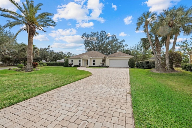 ranch-style home featuring a garage and a front yard