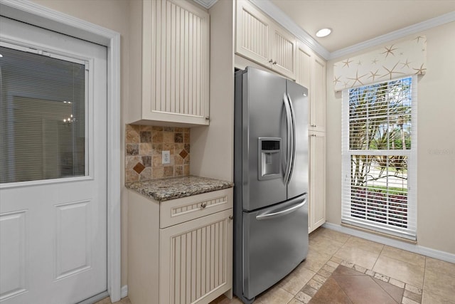 kitchen featuring light tile patterned floors, white cabinetry, backsplash, light stone counters, and stainless steel fridge with ice dispenser