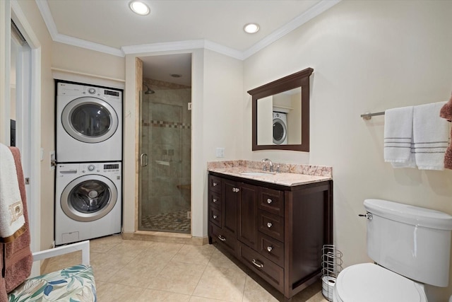 laundry area with light tile patterned floors, crown molding, sink, and stacked washing maching and dryer