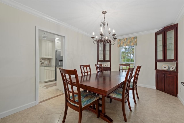 dining area featuring crown molding, a notable chandelier, and light tile patterned floors