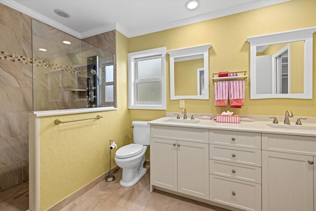 bathroom featuring tile patterned flooring, ornamental molding, vanity, tiled shower, and toilet