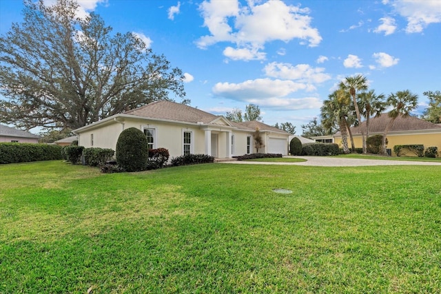 exterior space with a garage and a front yard